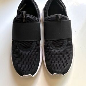 Sorel Women’s Kinetic Impact, Black and White Slip-On Sneakers